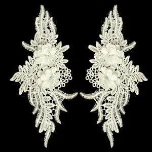 Detailed view of symmetrical white 3D floral lace embroidery appliques for DIY sewing
