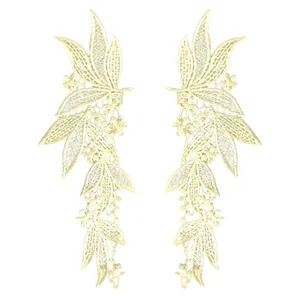 Detailed view of symmetrical cream floral lace embroidery patches for clothing DIY