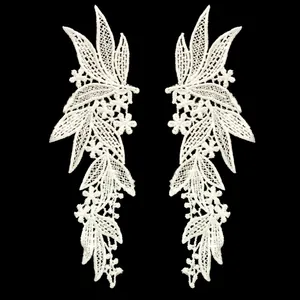A pair of symmetrical white polyester lace embroidery floral patches for DIY apparel crafts