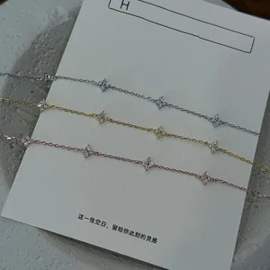 Detailed view of three s925 silver clover bracelets in silver, gold, and rose gold