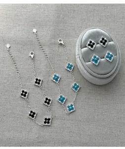 Detail view of S925 silver four-leaf clover jewelry set with agate and turquoise