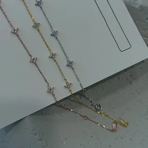 Detailed view of three s925 silver clover bracelets with sparkling cubic zirconia stones