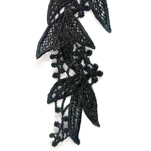 Detailed close-up of intricate black floral lace embroidery appliqué for DIY fashion