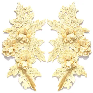 Detail von 3D-Spitzenstickerei-Blumenaufnähern in Gelb mit feiner Fadenarbeit