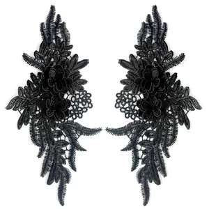 Close-up view showing the heavy embroidery detail on black lace floral applique patches