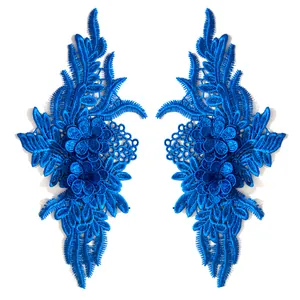 Detailed view of royal blue symmetrical lace floral embroidery patches for DIY
