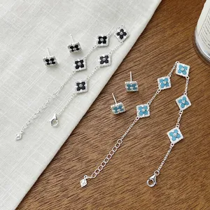 Elegant S925 silver clover jewelry set featuring onyx and turquoise stone inlay designs