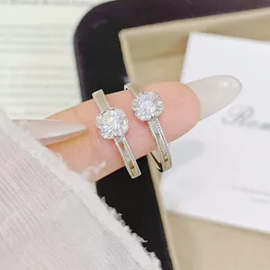 Macro detail of s925 silver push-pull rings with sparkling halo cubic zirconia.