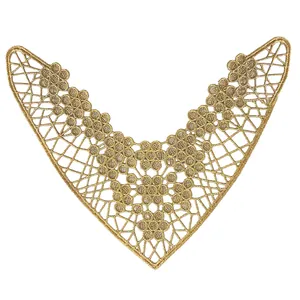 Detail view of golden V-shaped lace embroidery for shoe and garment accessories