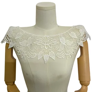 Detail view of white polyester lace embroidered fake collar on mannequin dress form
