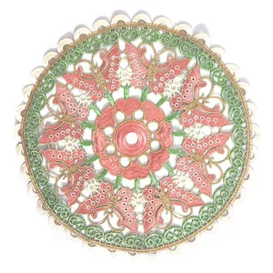 Detailed view of circular embroidered table mat with pink butterfly and floral patterns.