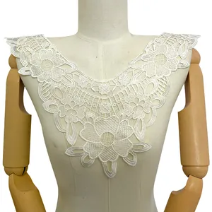 Detailed view of exquisite white floral lace applique neckline embroidery for garments