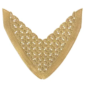 Detailed view of V-shaped golden embroidery lace patch with intricate hollow floral patterns