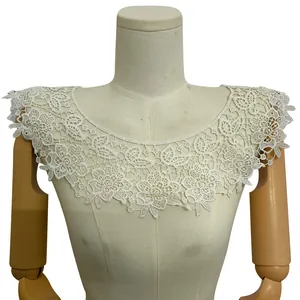 Close-up of white milk silk embroidered lace false collar with delicate flower pattern