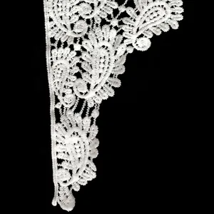 Detail view of white milk silk embroidered lace collar with water-soluble floral design
