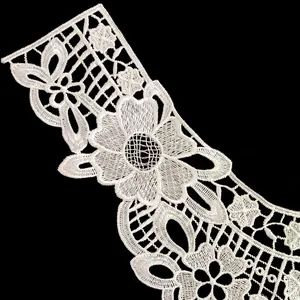 Detailed macro shot of premium white polyester embroidered hollow-out lace collar trim