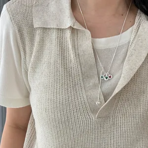 Detailed view of S925 silver necklace with multiple colorful heart gemstone pendants