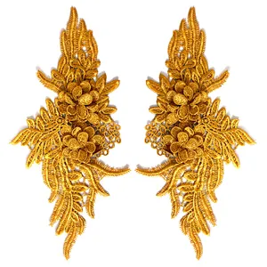 Detailed macro view of gold 3D lace floral embroidery appliques for DIY sewing projects.