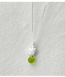 Close-up of S925 silver irregular apple necklace with a faceted green teardrop stone.