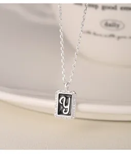Close-up of S925 silver square pendant necklace with diamond-encrusted letter y detail