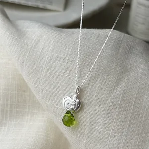 Elegant S925 sterling silver necklace with green teardrop and heart-shaped pendant.