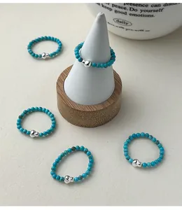 Detailed view of s925 silver turquoise beaded elastic ring with lucky gourd charm design