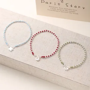 Handmade S925 silver beaded bracelets with clover bow and lock charms on colored ropes
