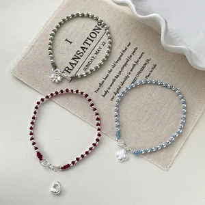 Handmade s925 silver beaded cord bracelets with bow and clover charms in red, blue, and green
