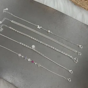 Collection of delicate S925 silver chain bracelets with varied charms and elegant designs