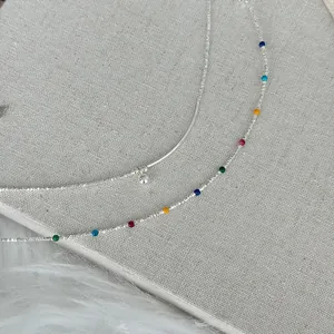 Close-up of s925 silver bracelet featuring vibrant colorful enamel beads and ball charm