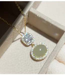 Close-up detail of S925 silver necklace with oval Hetian jade and diamond accents
