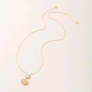 Elegant S925 sterling silver necklace featuring an oval Hetian jade and zircon pendant