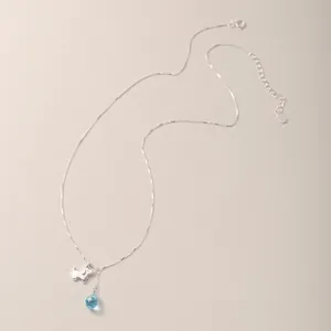 Minimalist S925 silver necklace with cute puppy charm and blue teardrop stone