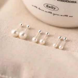 Elegant 925 sterling silver faux pearl screw back earrings in three different sizes.