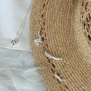 Collection of 925 sterling silver minimalist necklaces with clover and dachshund pendants