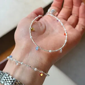 Close-up detail of 925 sterling silver necklace featuring colorful zirconia stones