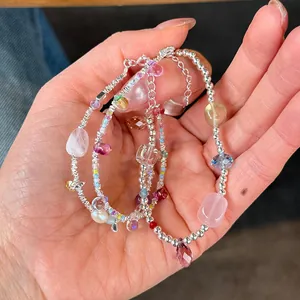 Detailed close-up of handmade 925 sterling silver bracelets with irregular crystals and pearls