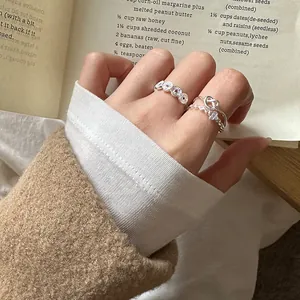 Macro view of 925 sterling silver stackable rings with clover and knot patterns
