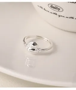 Close-up detail of elegant silver gourd ring with small crystals and adjustable band