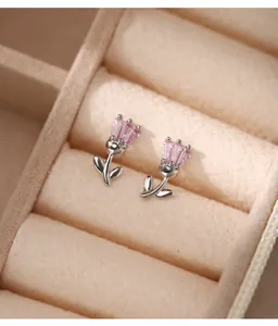Close-up detail of s925 sterling silver tulip stud earrings with delicate pink crystal petals