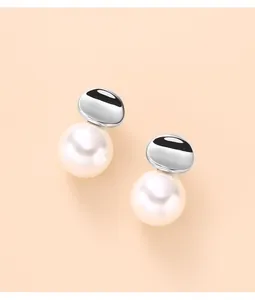 Detail view of 925 sterling silver stud earrings with irregular disc and white pearl.