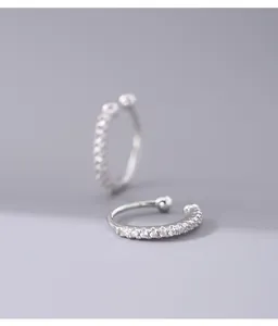 Macro detail of 925 sterling silver ear cuff with paved stones for non-pierced ears