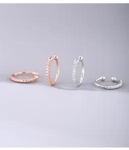Detail view of 925 sterling silver ear cuffs with pavé-set shimmering cubic zirconia