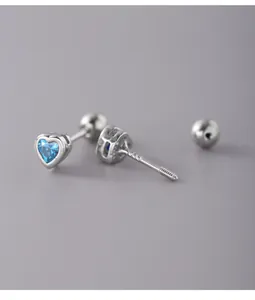 Detailed macro view of S925 sterling silver heart stud earring with blue zircon stone