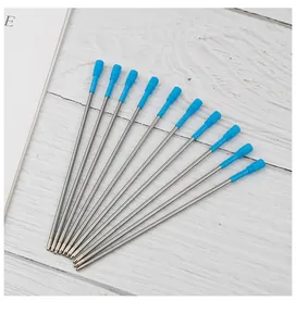 Detailed view of eleven 116mm metal ballpoint pen refills with blue plastic top caps