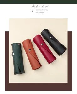 Detailansicht von vier verschiedenfarbigen PU-Leder Federmäppchen mit Metallknopfverschluss