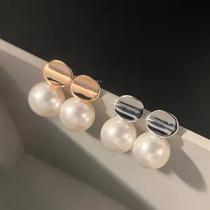 Elegant 925 sterling silver stud earrings with irregular discs and white pearls