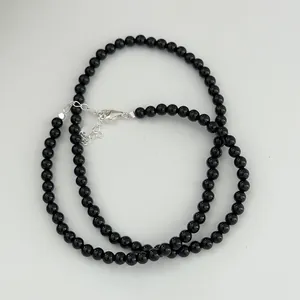 Macro detail view of black agate beaded necklace with s925 sterling silver clasp