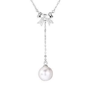 Elegant 925 sterling silver bow necklace featuring a large white pearl pendant design