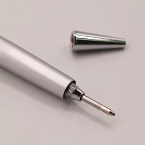 Close-up of a premium matte silver metal ballpoint pen showing the precision tip